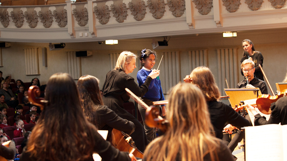 Pupil conducting at a Sparks lunchtime concert for schools